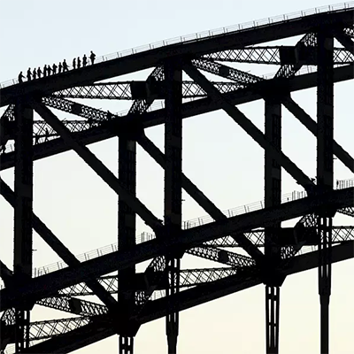 Group of people seen climbing Sydney Harbour Bridge