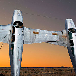 Two planes sit upright in the desert of the Oodnadatta Track