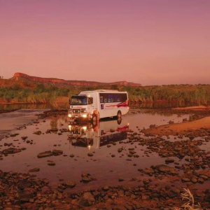 APT 4WD vehicle driving through water in the Kimberley