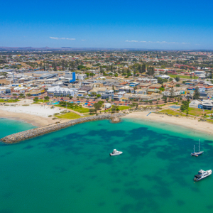 Turquoise water with town on the beachfront