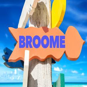 Sign with turquoise ocean in the background